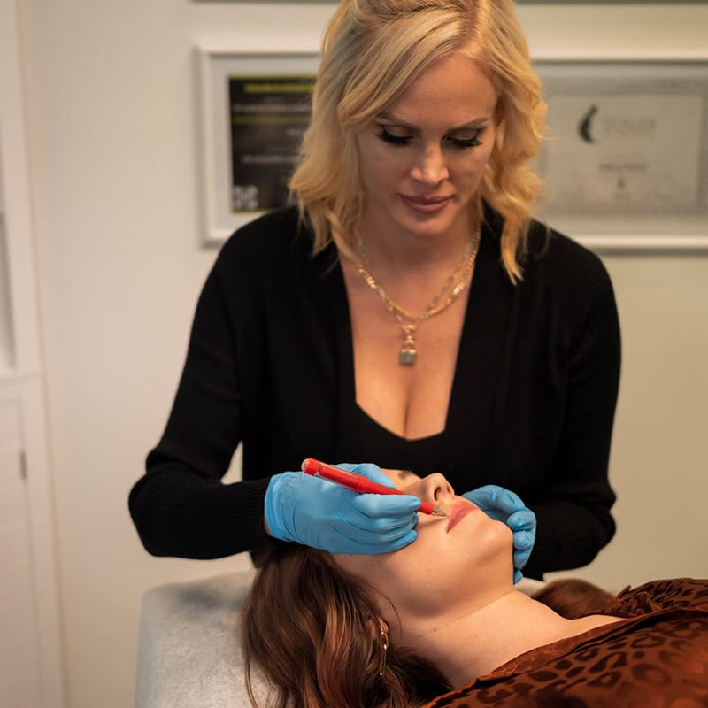 Mary Katz performing permanent makeup at Beauty on Broadway